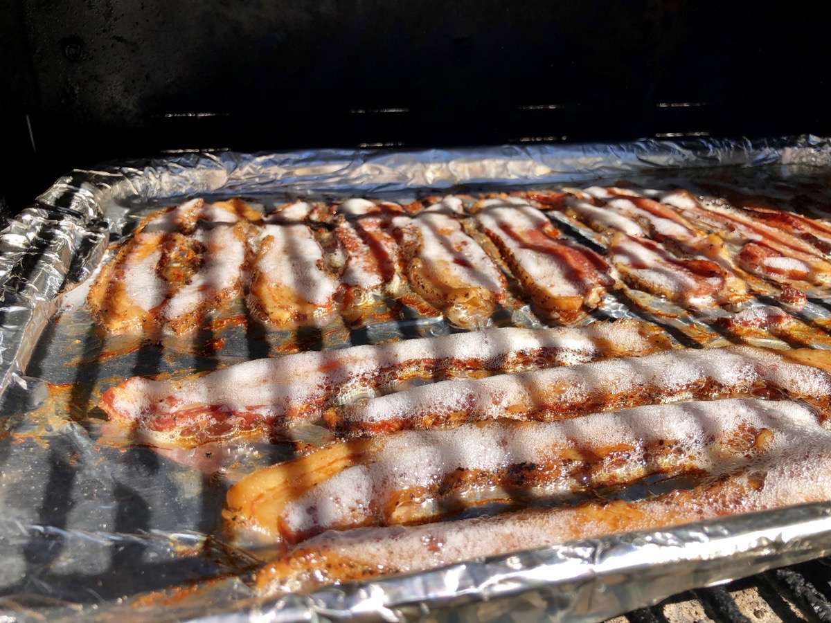 Sizzling bacon cooking on MAK 2 Star Pellet Grill