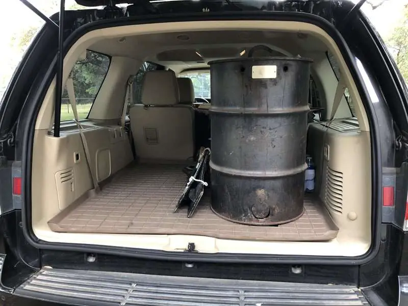 Pit Barrel Cooker in the back of full size SUV... fits perfect! All accessories and even charcoal can be stored inside the cooker.