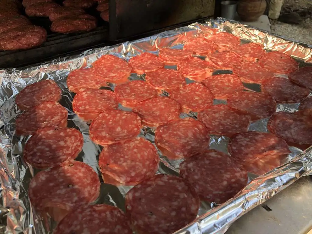 Italian Dry Salami laid out on foil lined cookie sheet