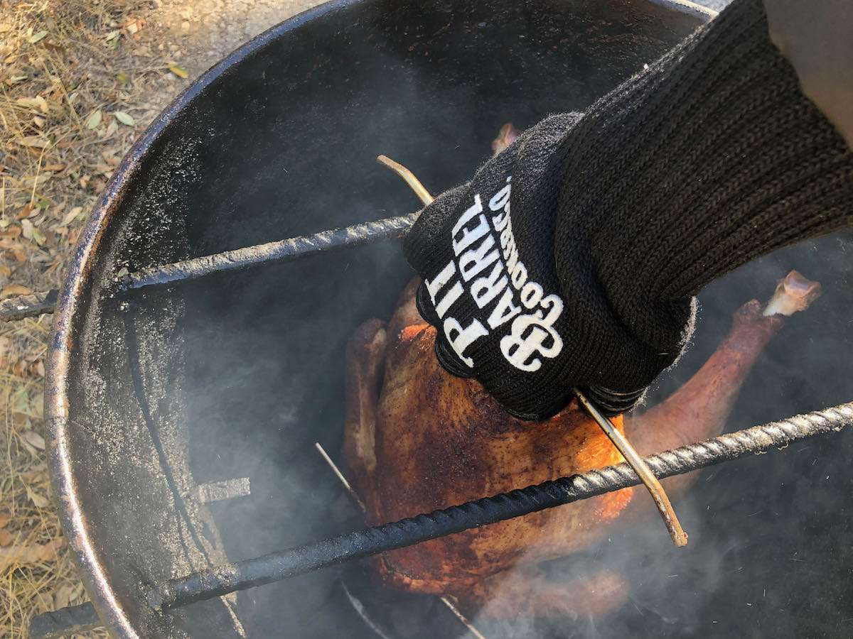 Use your insulated BBQ gloves when removing your turkey. We use the Pit Grips Glove by Pit Barrel Cooker Co.