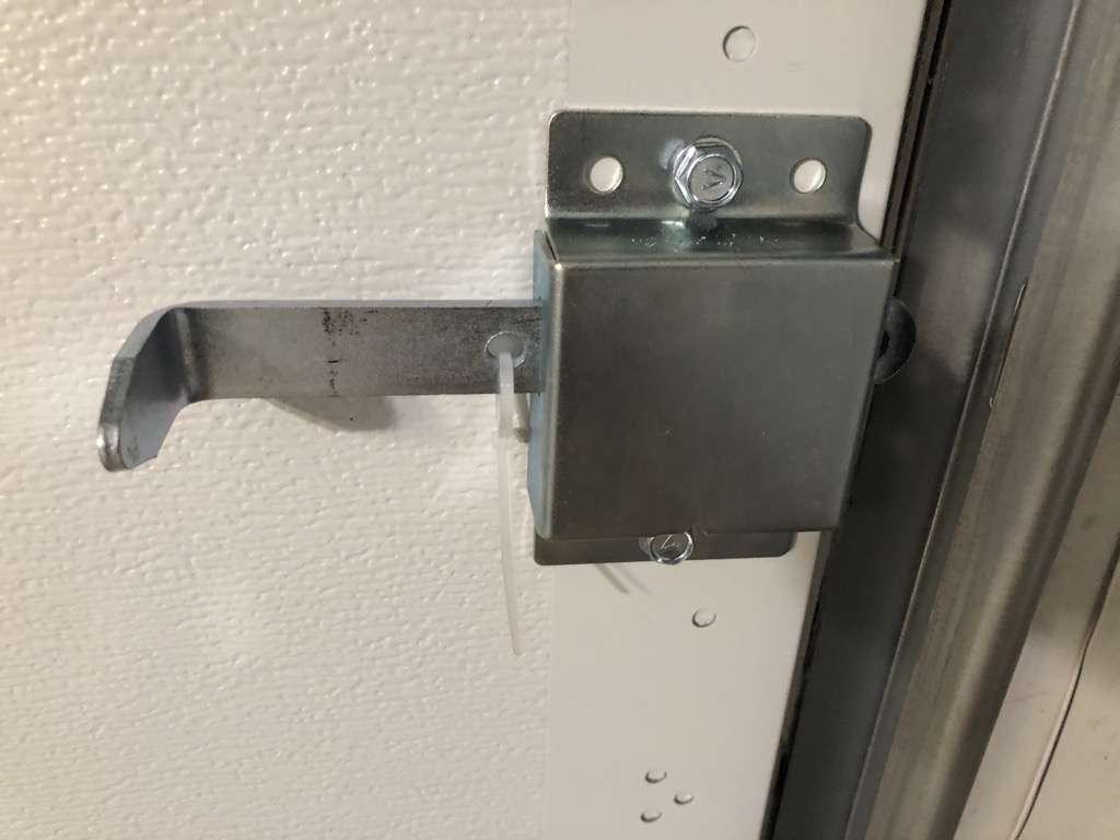 Garage door slide lock disabled with zip tie