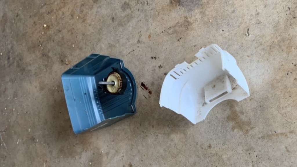 The housing cracked on a Genie Chain Glide garage door opener causing the cover and drive gear to fall to the garage floor.