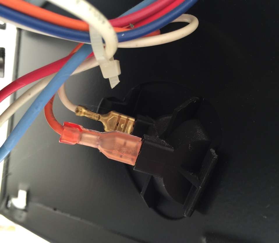 Wiring connections on back of the light bulb socket.