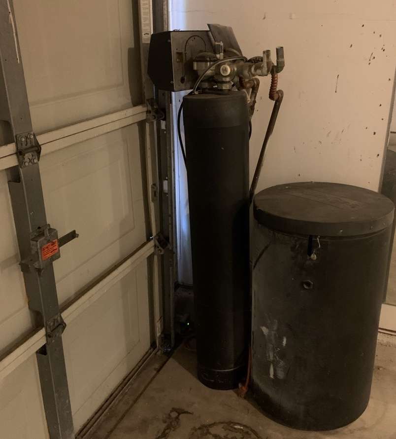 Water softener installed very close to the garage door. When you refill the salt tank, salt dust usually goes every which way and can cause a garage door to rust.