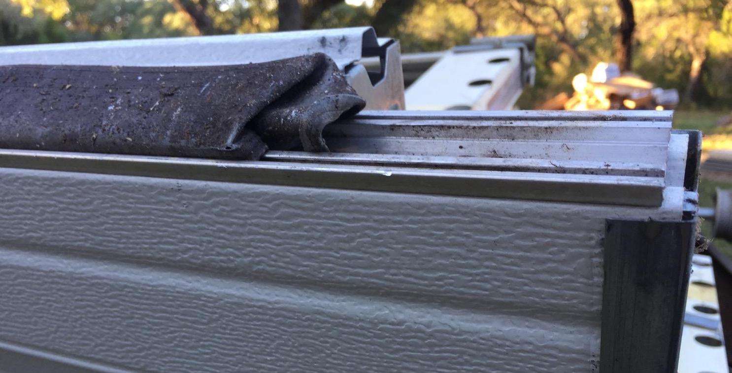 Shrunk weather seal on bottom of garage door