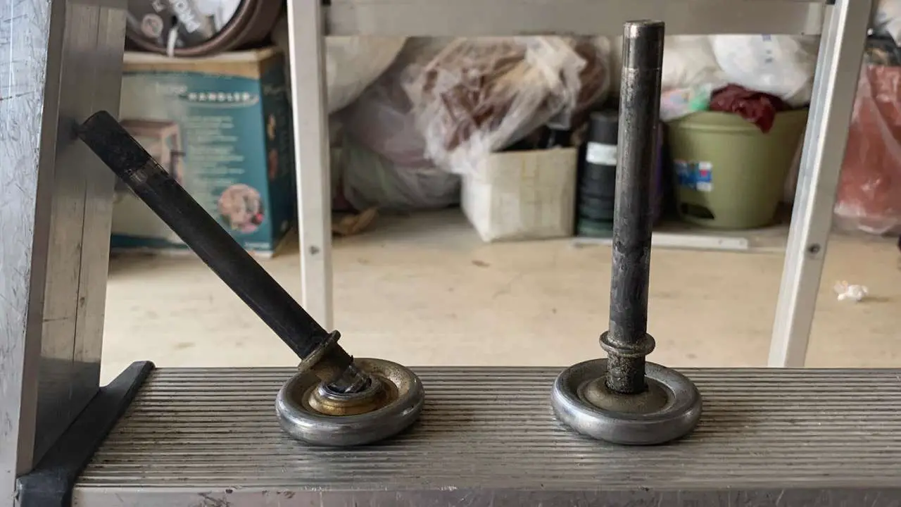 Garage door roller on left has complete ball bearing failure.