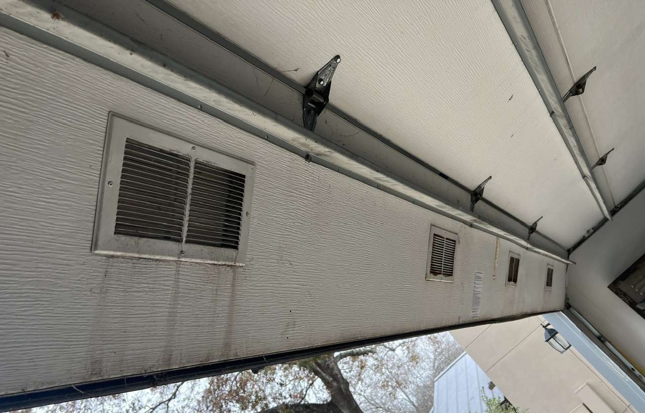 Four vents installed on insulated steel back garage door.
