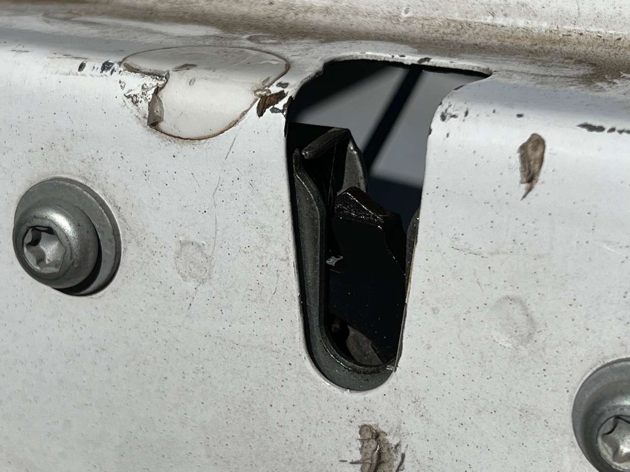 Locking end latches on tailgate that engage the permanent stud on the truck to secure the tailgate. These need to be lubricated.