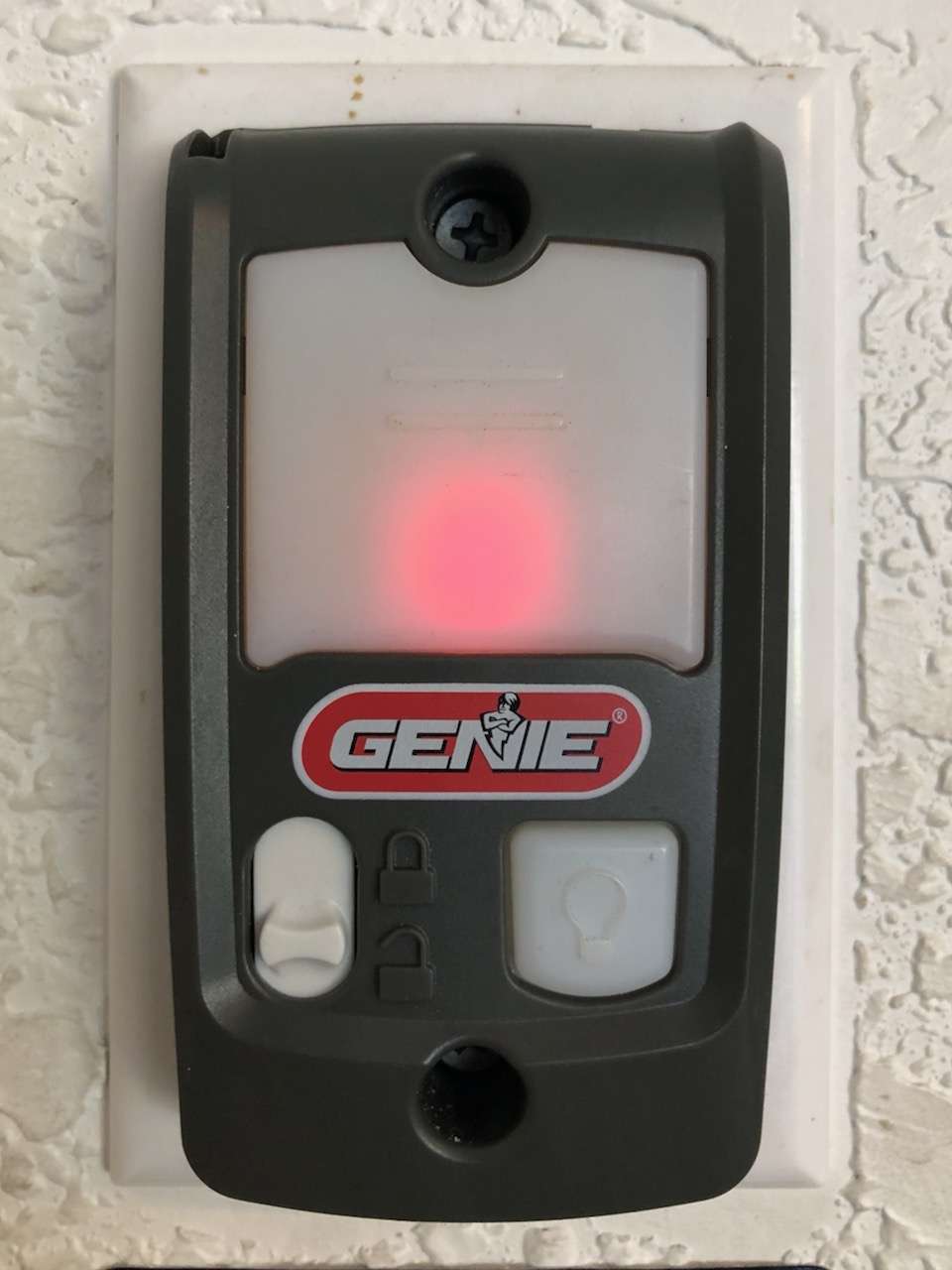 Newer style Series II Genie deluxe wall button SKU# 39165R with white buttons.