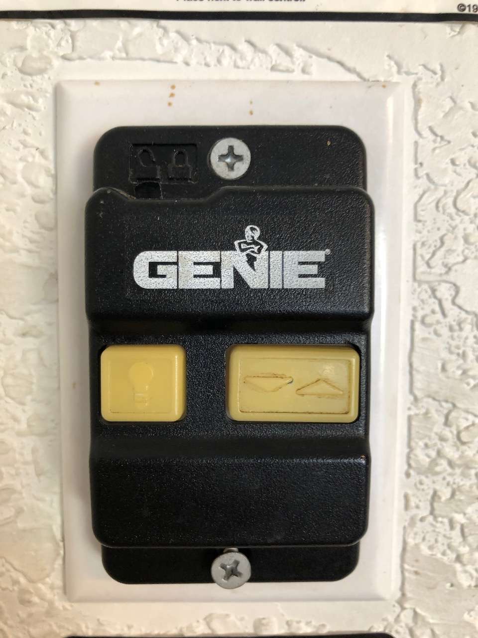 Older Series II Genie deluxe wall button. This unit is no longer manufactured, but sometimes can still be found online.