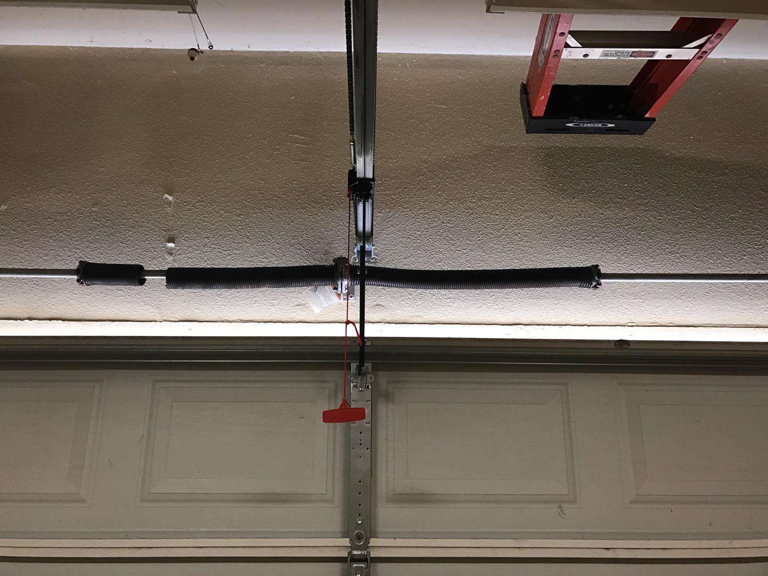Broken spring on garage door. Photo was sent by customer which makes it very easy to quote by text message.