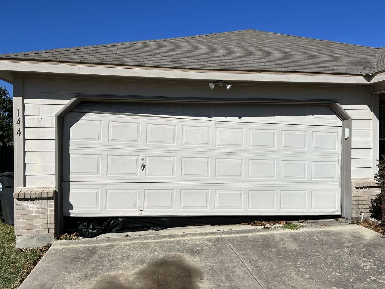This is a basic off track garage door that can be repaired quickly by a qualifed garage door company.