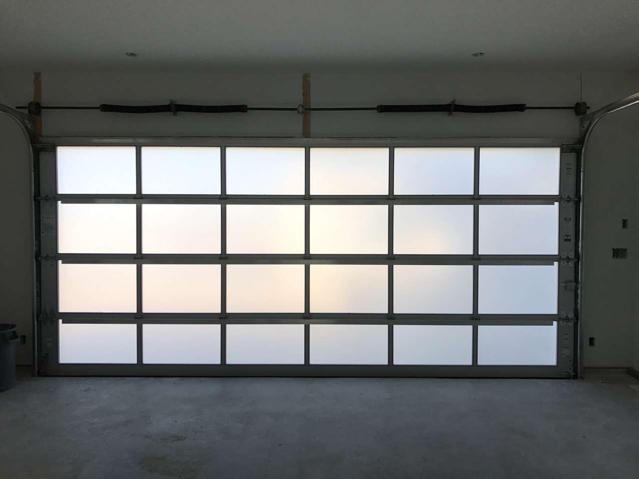 Full view frosted glass garage door.