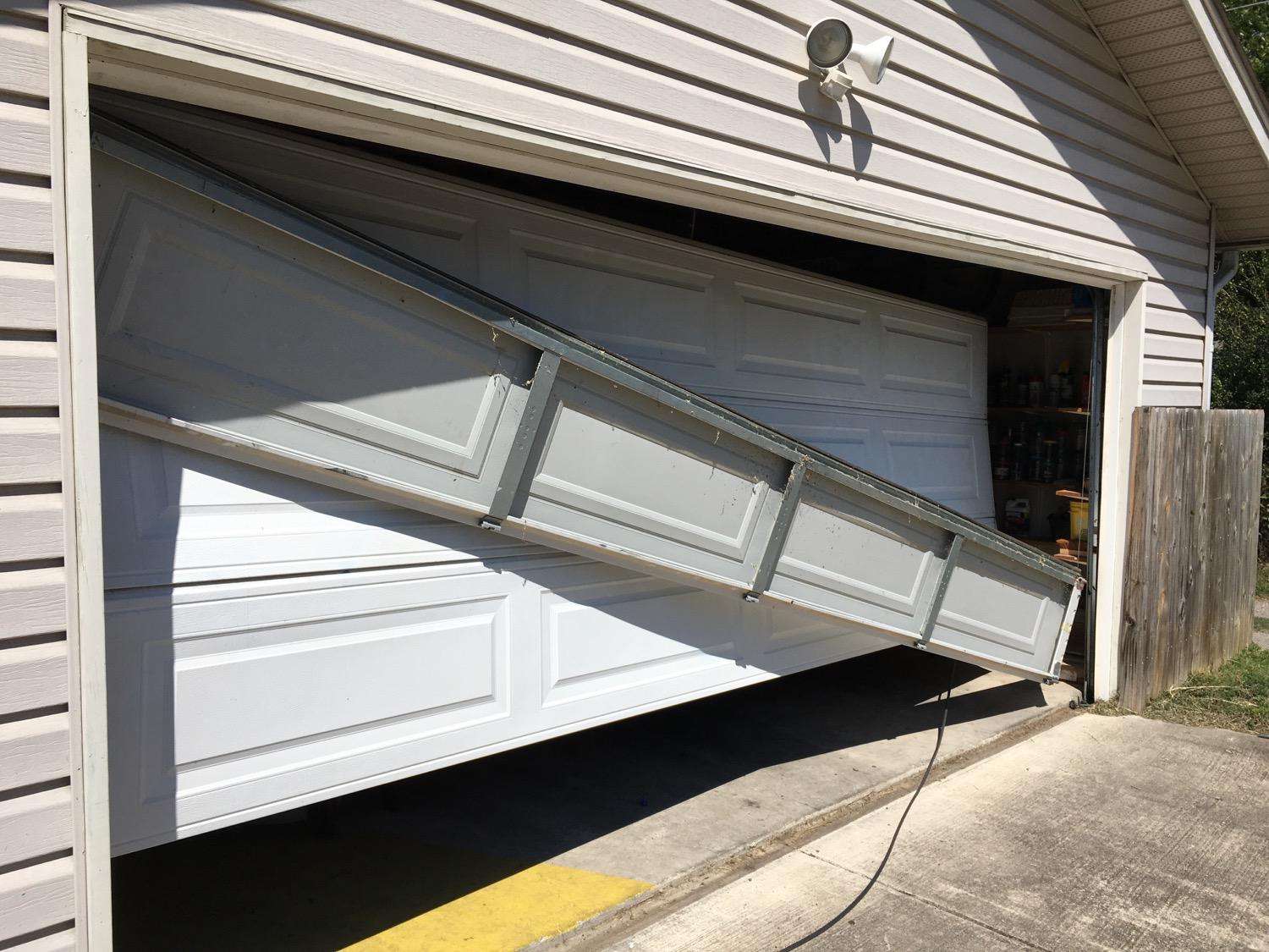 Top section of garage door fell in front of the door. You don't see this very often.