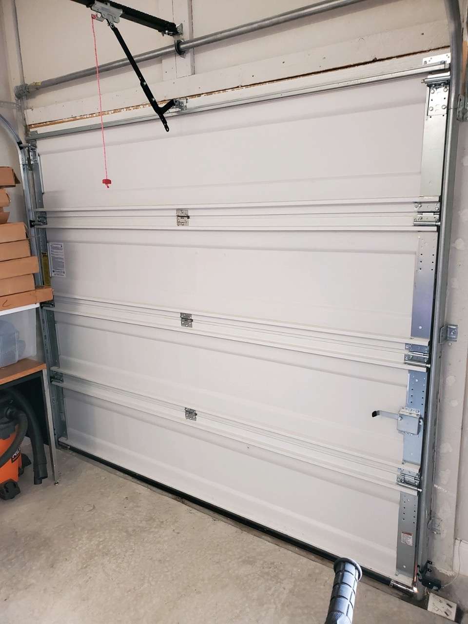 Wayne Dalton 9100 garage door installed by home builders. This garage door gets most of its strength from foam. You wan't to avoid having this garage door installed in your home.