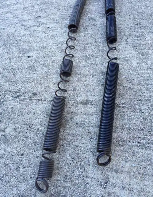 These extension springs are sprung. This means they are no longer pulling their weight which causes additional strain on your garage door opener. They need to be replaced.