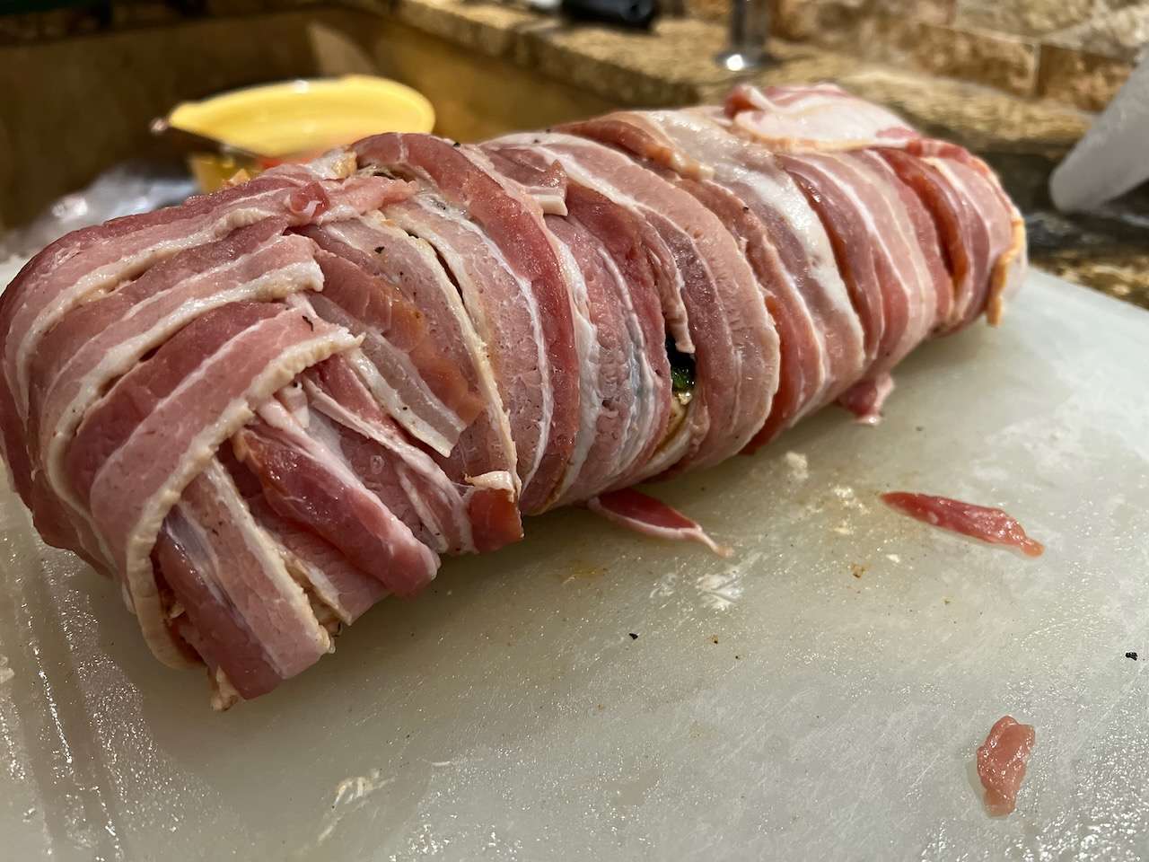 Bacon wrapped stuffed cream cheese and jalapeno pork loin.