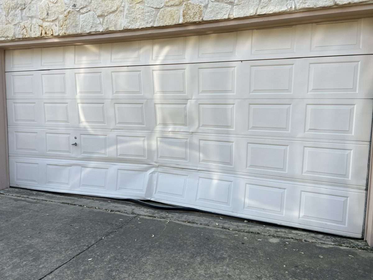 18x8 garage door hit by a vehicle.