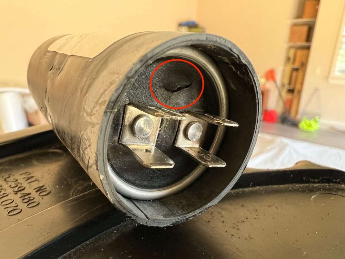 The small crack in the starting capacitor shows where the pressure was released when it blew.