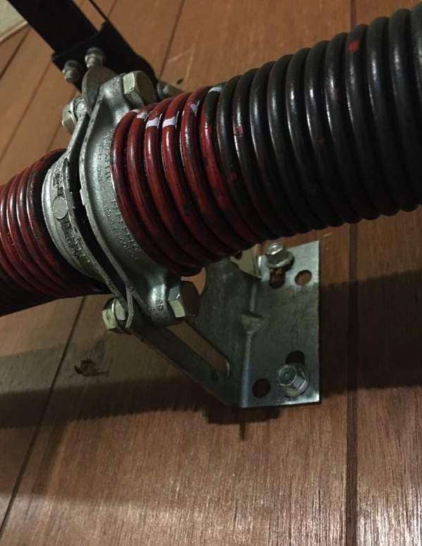The torsion spring pad is the fixed side of the spring that is attached to the header and doesn’t move.