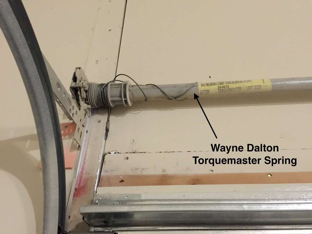 Wayne Dalton Torquemaster tube above garage door. The springs are inside the tube.