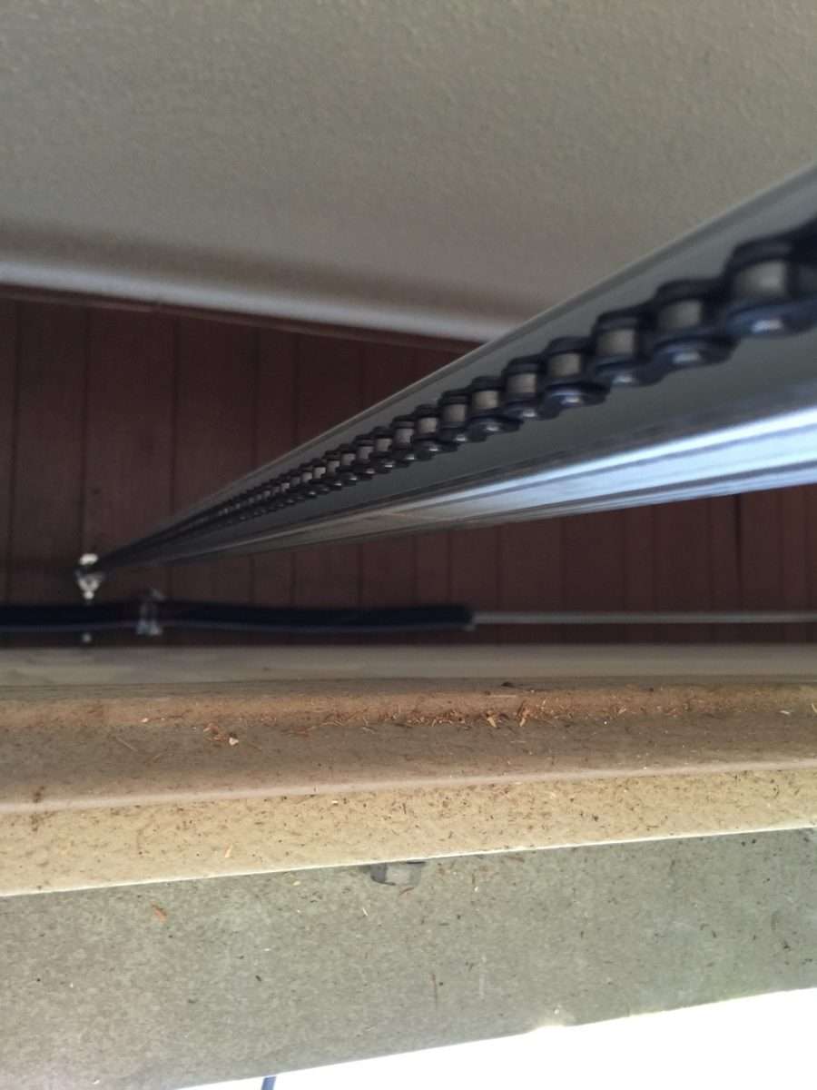 Chain drive garage door opener rail on Linear opener.