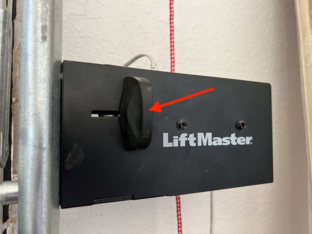 Manual slide release lever on LiftMaster 841LM automatic lock.