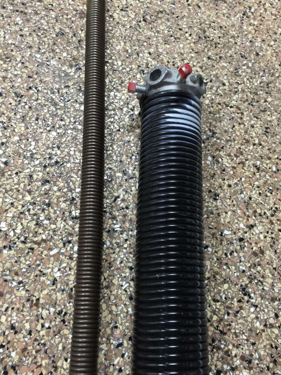 Torquemaster spring on left and 2” torsion spring on right.