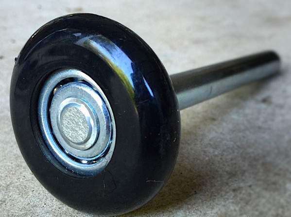 Nylon wheel garage door rollers with ball bearings.