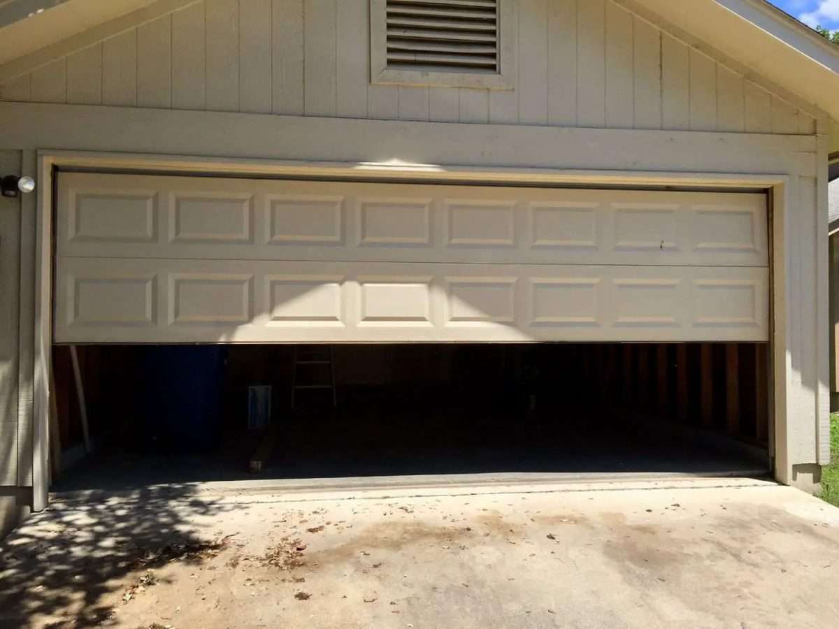 A properly balanced garage door should stay in place when opened half way.