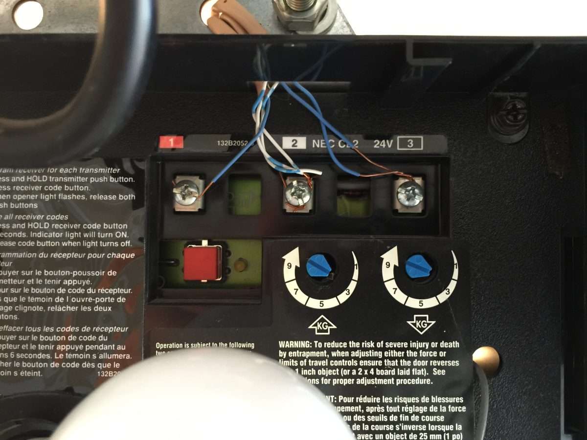 The blue dials are the manual open and close force adjustments on the garage door opener motor.