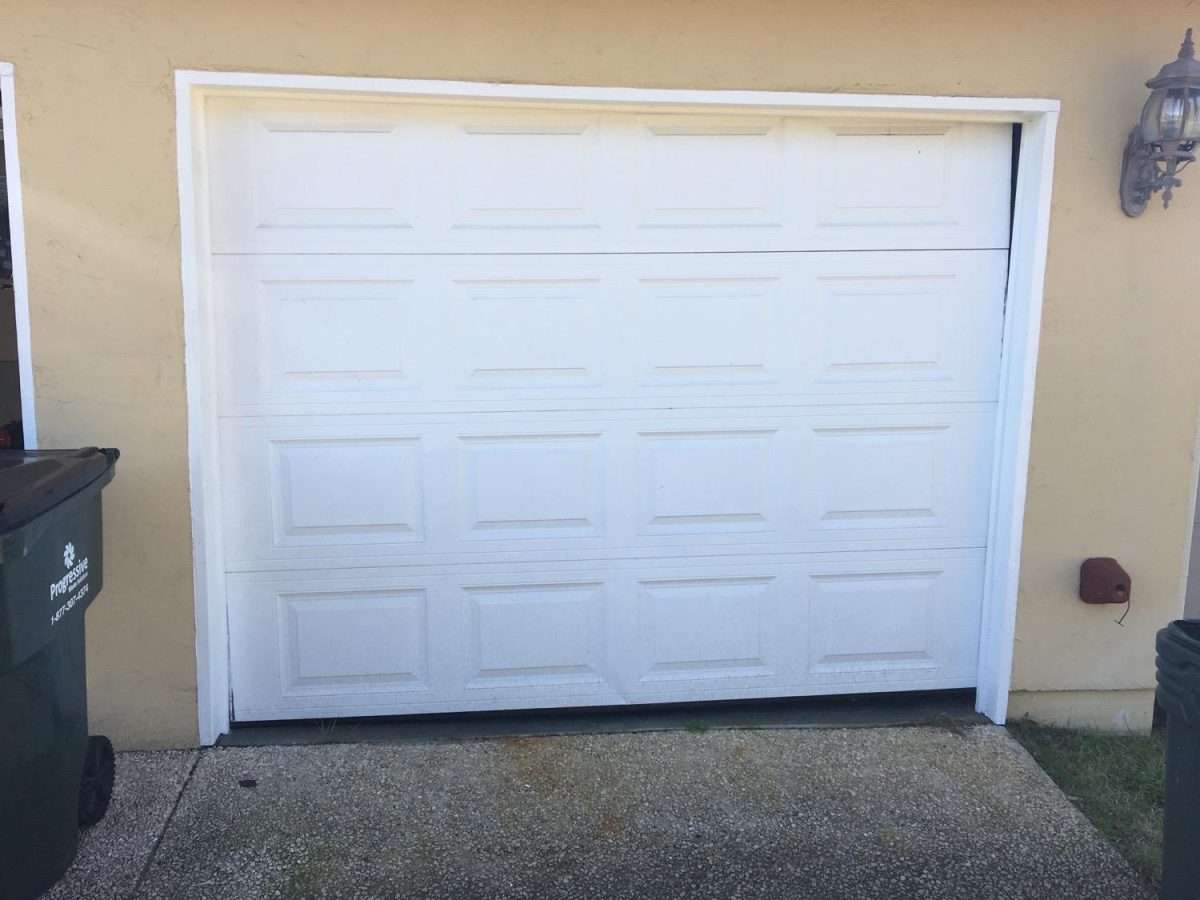 Cable off the drum on one side on a single car width garage door.