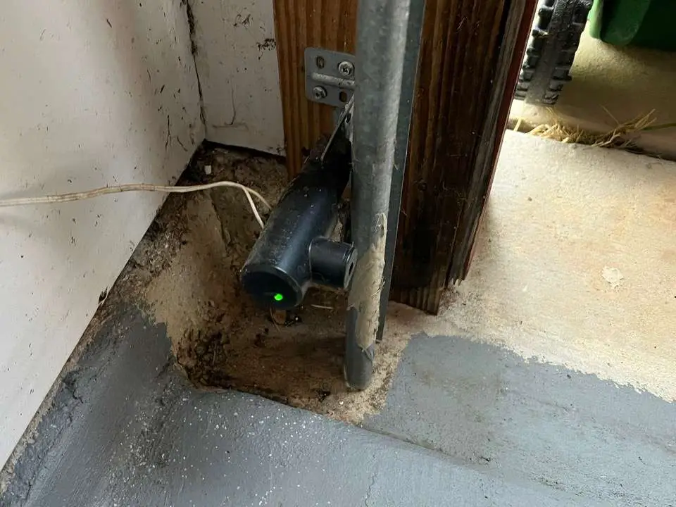 Newer style sending safety sensor on Genie and Overhead Door garage door openers.