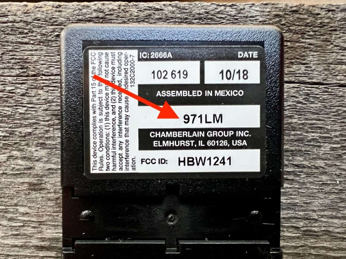 Back of LiftMaster 971LM remote which shows the date and model of the remote.